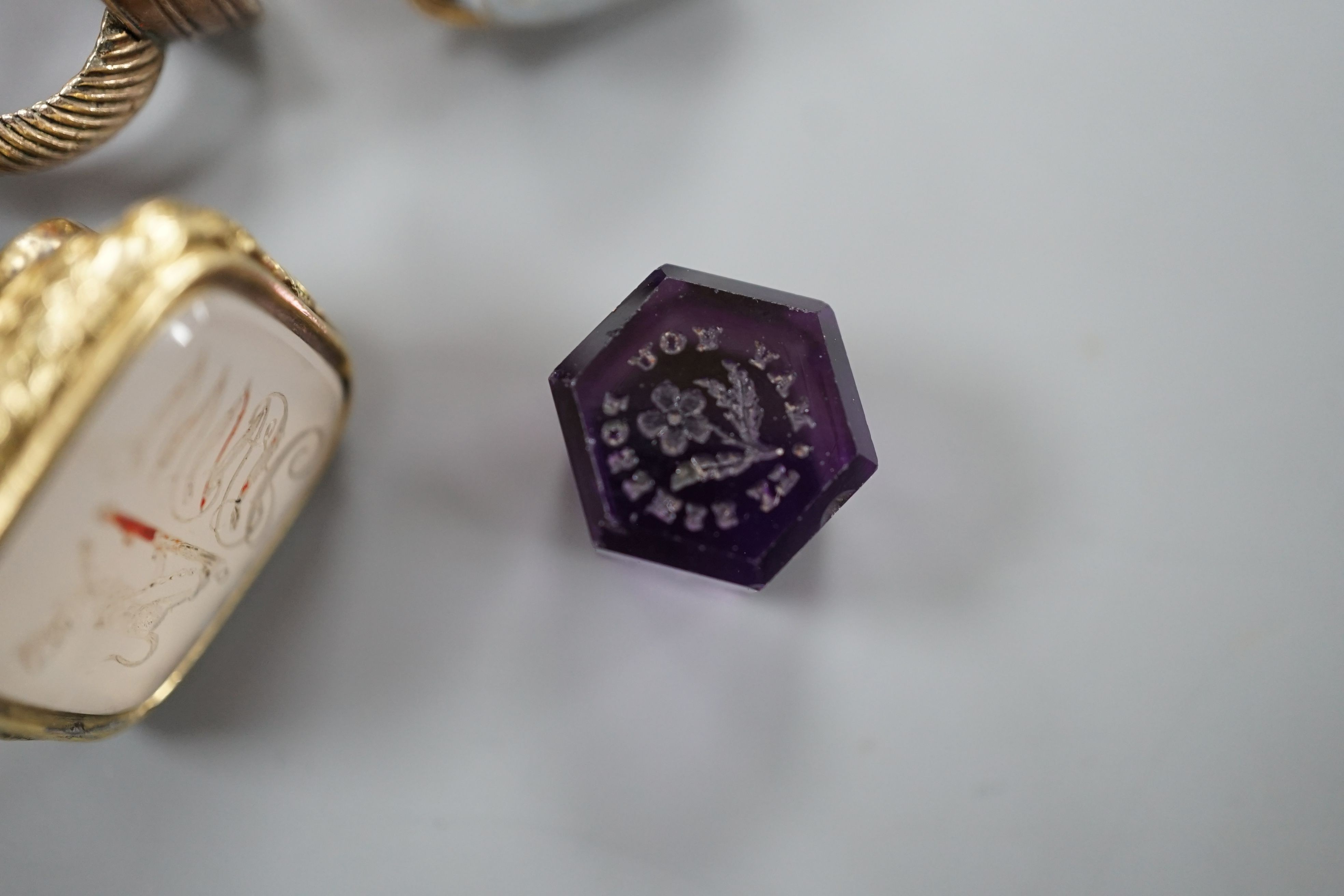 Eight assorted 19th century and later fob seals including a rose diamond set black glass dog with Roman head intaglio, 3cm, a gold overlaid and watch key